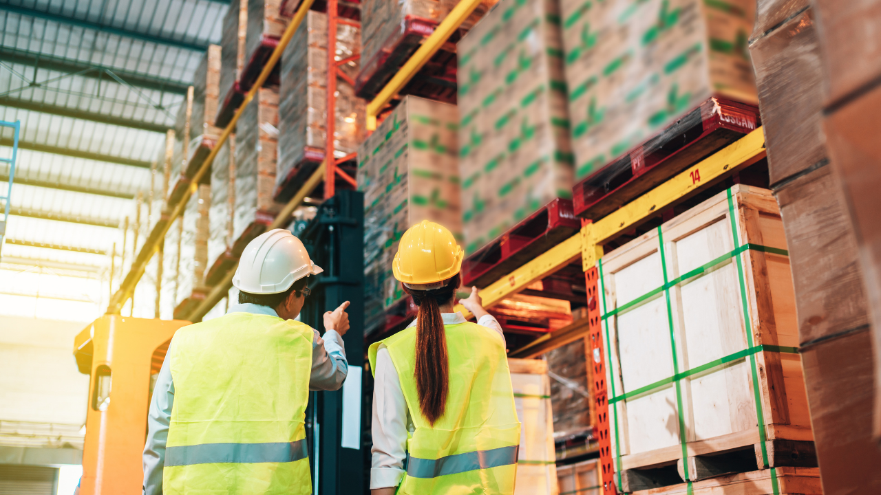 Warehouse workers stacking boxes